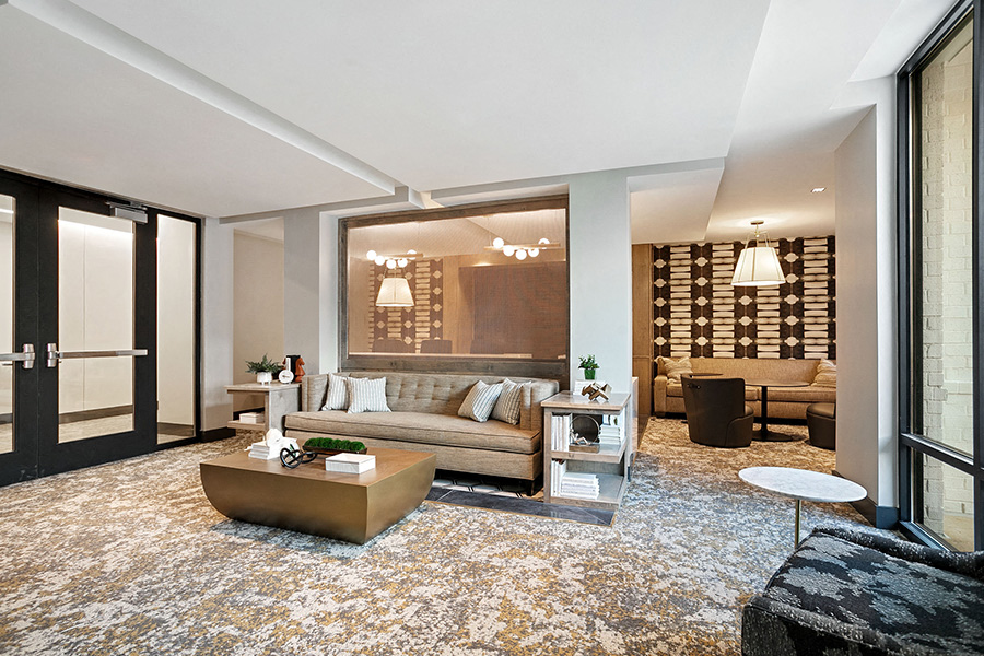 A modern living room with a large sofa and a coffee table.